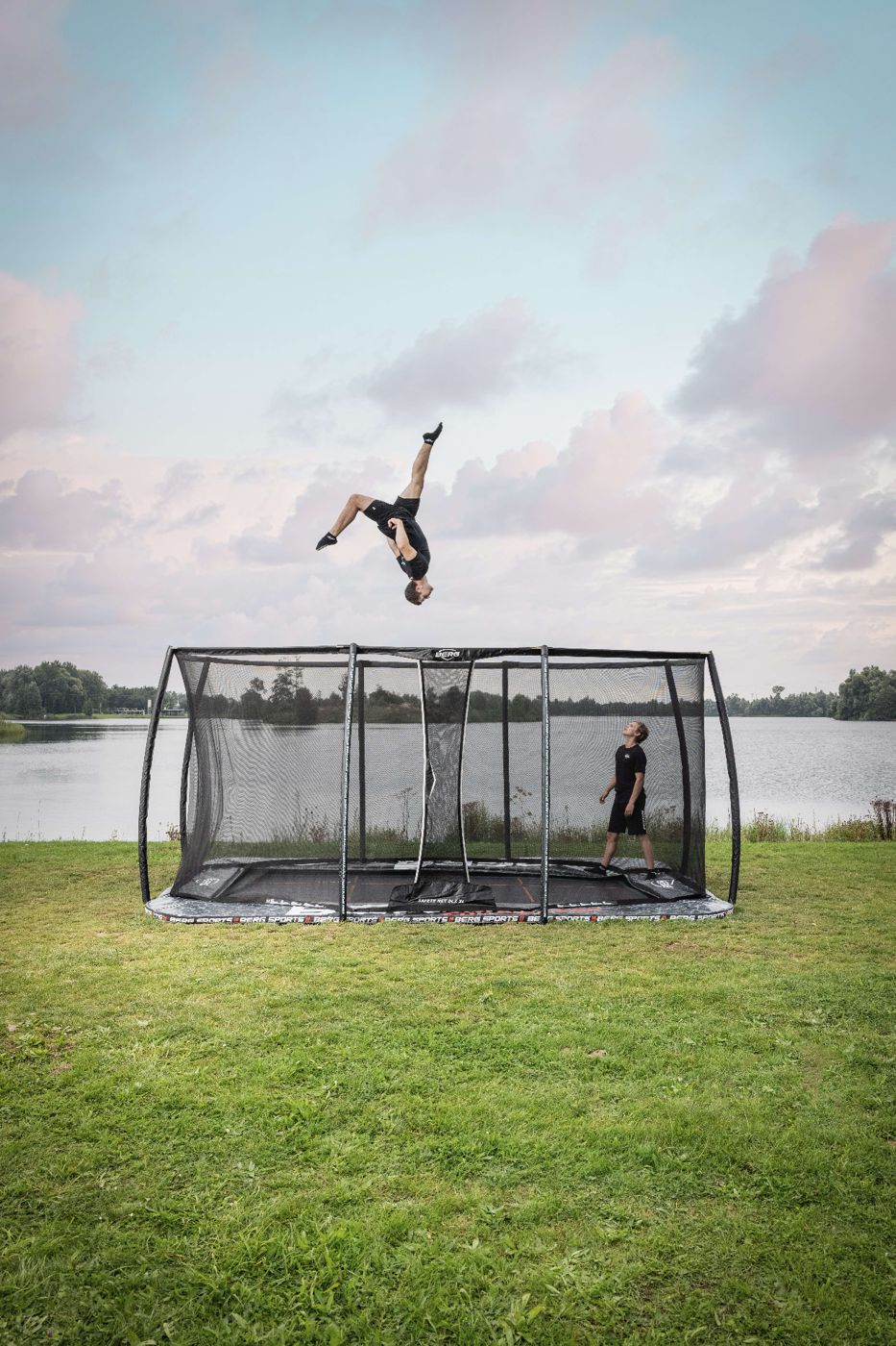 BERG trampoline set into a garden lawn